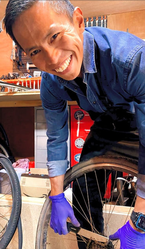 Marv working on a bike wheel in the TuneUp Cycles workshop